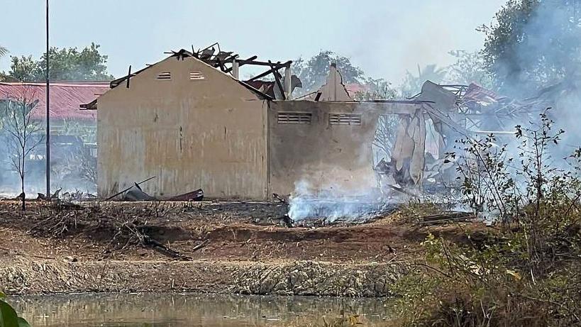  Smoke billows from the warehouse following an explosion at an army base in Kampong Speu province, Cambodia.