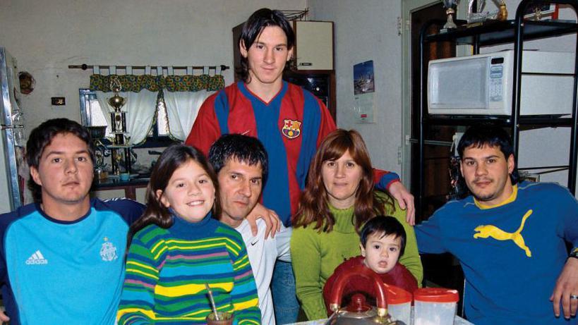 Lionel Messi poses with his brother Rodrigo, sister Maria Sol, father Jorge, mother Celia, nephew Tomas and brother Matias during a private photo session in October 2003