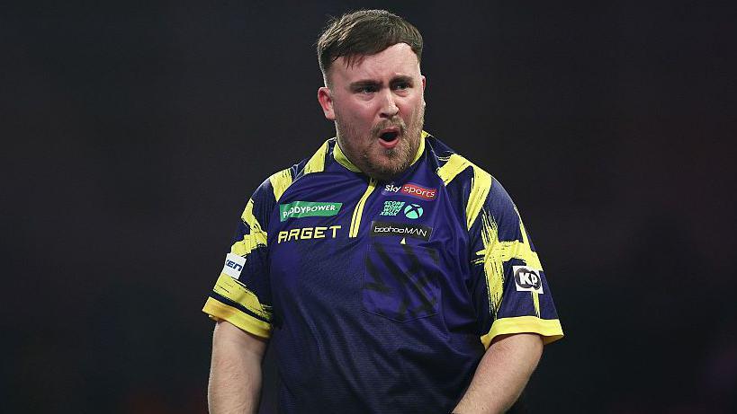 Luke Littler celebrates