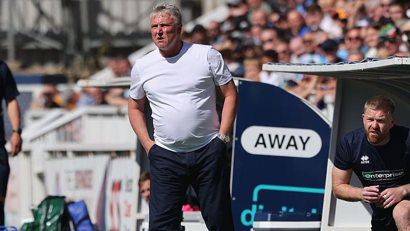 Hartlepool United manager Lee Clark looks on from the dug-out in the Pools' win over Barrow.