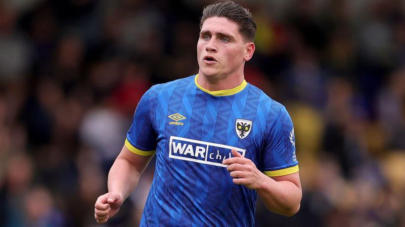 Matty Stevens in action for AFC Wimbledon