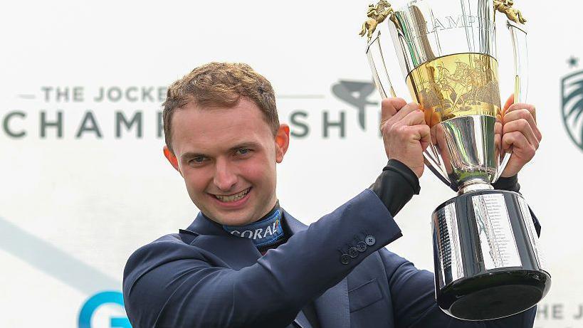 Sean Bowen celebrates his Champion Jockey title.