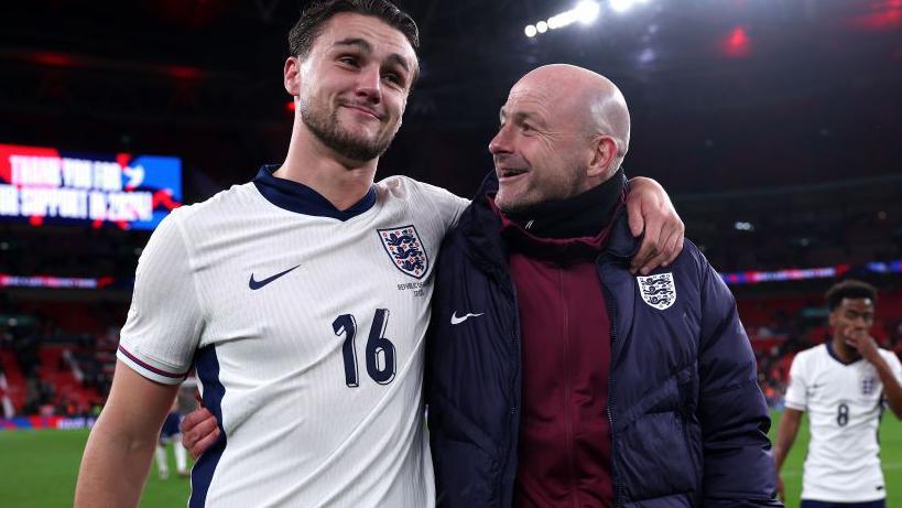 England interim manager Lee Carsley congratulates Taylor Harwood-Bellis on his debut goal against the Republic of Ireland