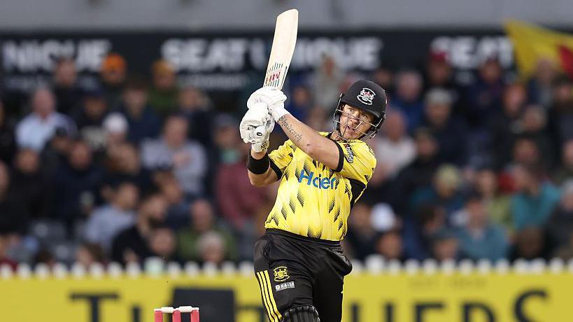 D'Arcy Short plays a pull shot across his body and watches the ball race away with his bat in the air