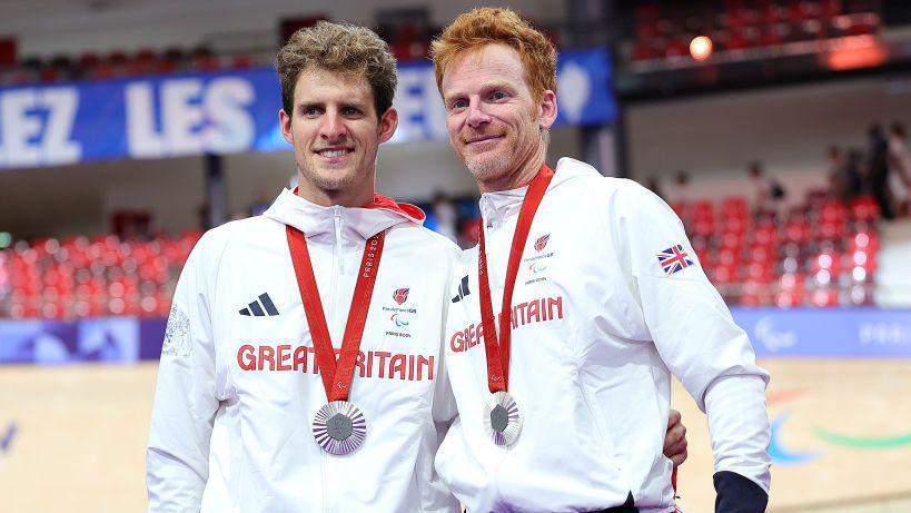 Stephen Bate (right) and Chris Latham pose with silver medals