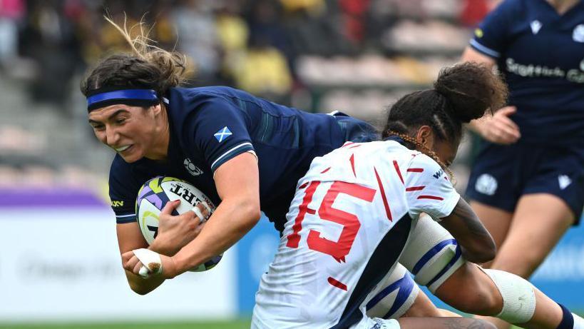 Emma Wassell is tackled while playing for Scotland in the 2023 WXV competition