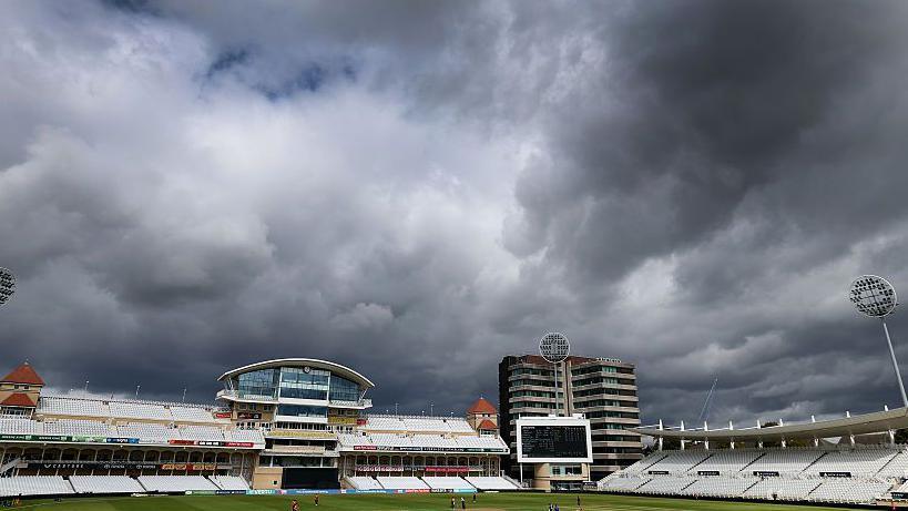 A gloomy cloudy sky over Trent Bridge takes up the majority of the image, showing the Radcliffe Road end and empty stands, whilst the Blaze are in the field vs Lancashire Women 