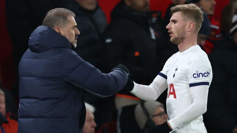 Timo Werner shaking Ange Postecoglou's hand after being substituted