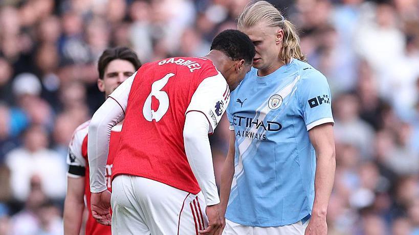 Gabriel appears to push his head into the face of Erling Haaland during the Premier League match between Manchester City and Arsenal at Etihad Stadium
