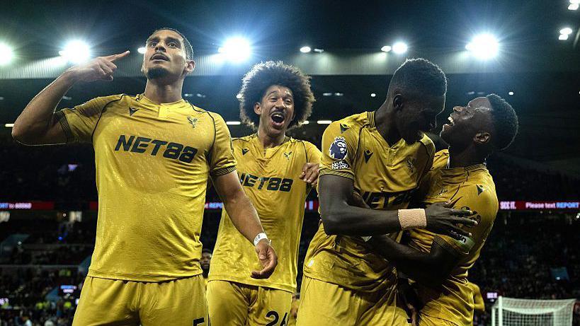 Marc Guehi (right) after scoring for Crystal Palace against Aston Villa on Sunday night