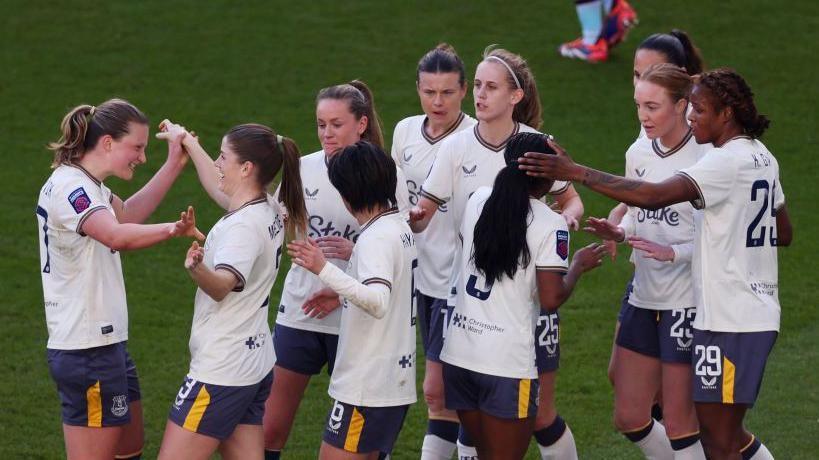 Everton's players celebrate their first goal, scored by Maren Mjelde