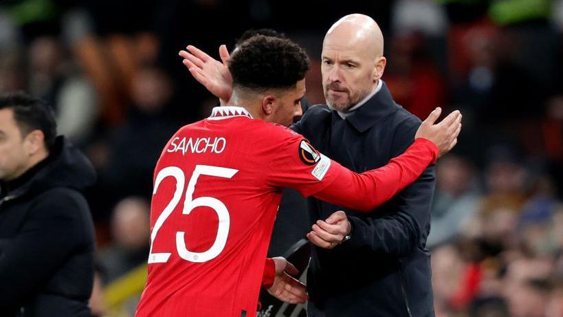 Erik ten Hag hugging Jadon Sancho as he is substituted. 