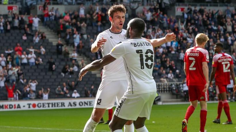 Matt O'Riley celebrates while playing for MK Dons