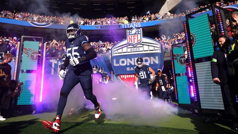 Baltimore Ravens players run out at Tottenham Hotspur Stadium