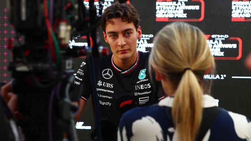 George Russell is interviewed at the Abu Dhabi Grand Prix