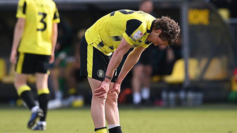 Reece Smith of Harrogate Town reacts to relegation