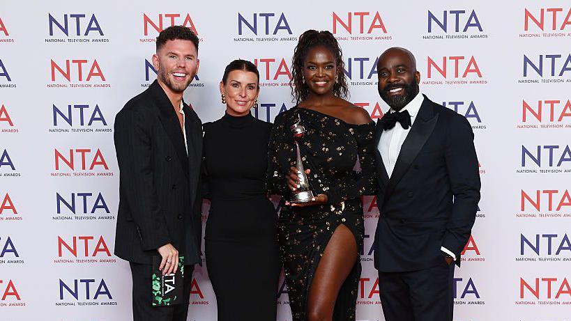 (L-R) Dean McCullough, Coleen Rooney, Oti Mabuse and Melvin Odoom pose after winning the 'Reality Competition' Award for 'I'm a Celeb' during the NTA's 2025 at The O2 Arena on September 10, 2025 in London, England