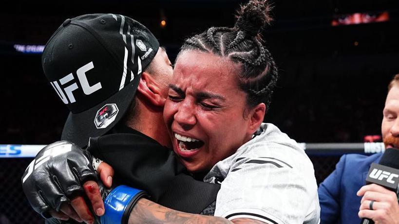 Puja Tomar celebrates after beating Rayanne dos Santos on her UFC debut in June