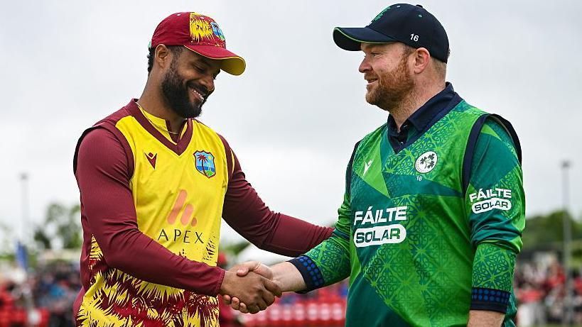 Ireland's Paul Stirling shakes hands with West Indies counterpart Shai Hope