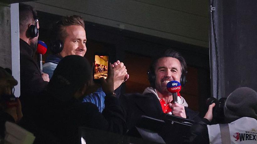 Wrexham co-chairmen Ryan Reynolds and Rob Mac celebrate