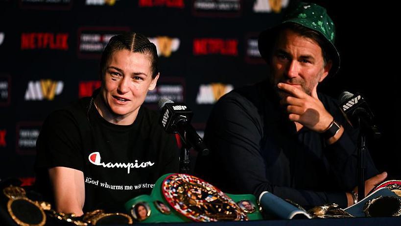Katie Taylor flanked by Eddie Hearn following her win over Amanda Serrano in New York last summer