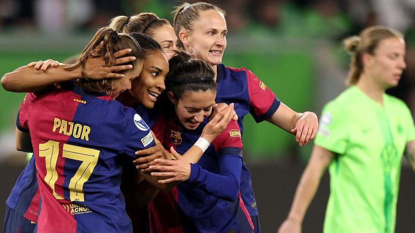 Barcelona celebrate scoring against Wolfsburg