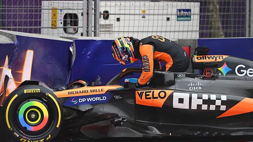 Oscar Piastri getting out of his McLaren after crashing into the wall in Baku