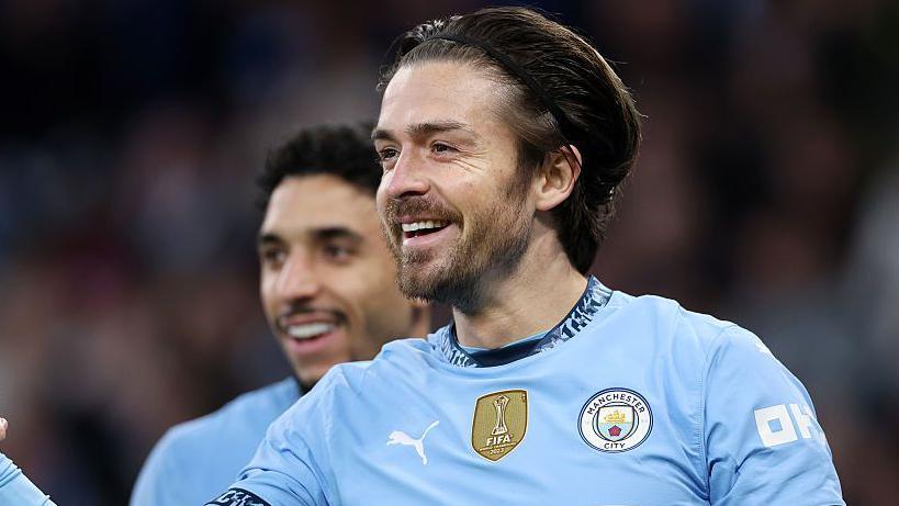 Jack Grealish celebrating a goal for Manchester City.