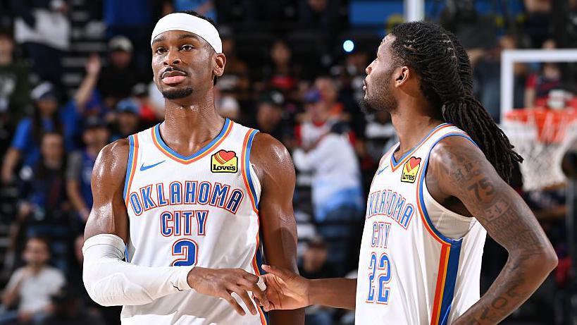Shai Gilgeous-Alexander (left) and Cason Wallace (right) of the Oklahoma City Thunder shake hands