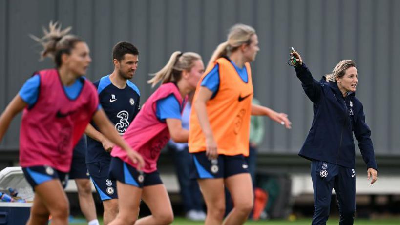 Bompastor leads the Chelsea squad in a training drill