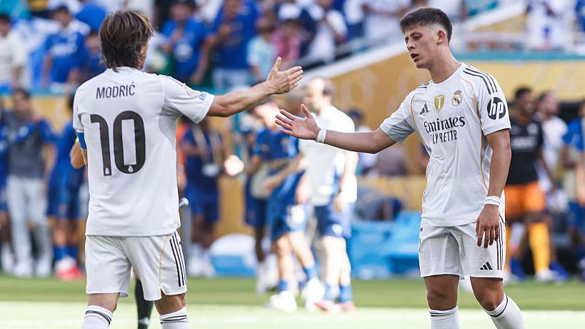 Luka Modric and Arda Guler shake hands during a Real Madrid Club World Cup match