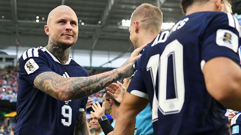 Lyndon Dykes on the sideline during Scotland's game against Brazil