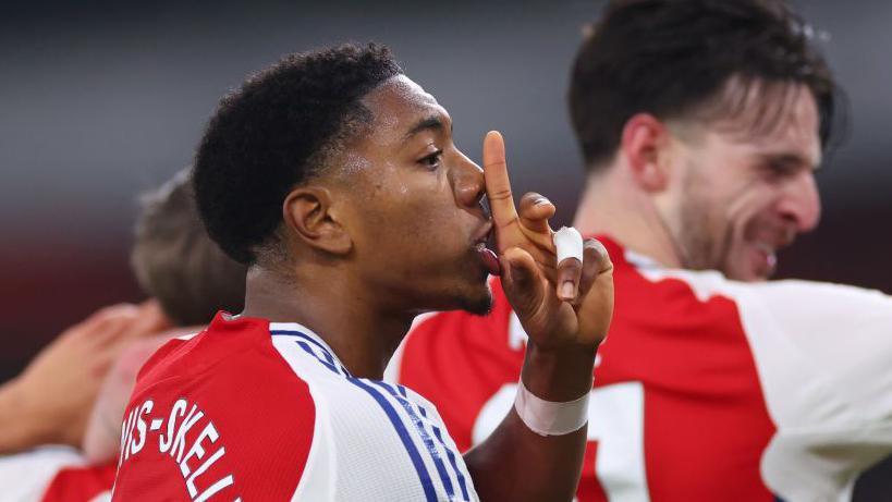 Myles Lewis-Skelly joins the celebrations after Leandro Trossard gives Arsenal the lead against Tottenham at Emirates Stadium