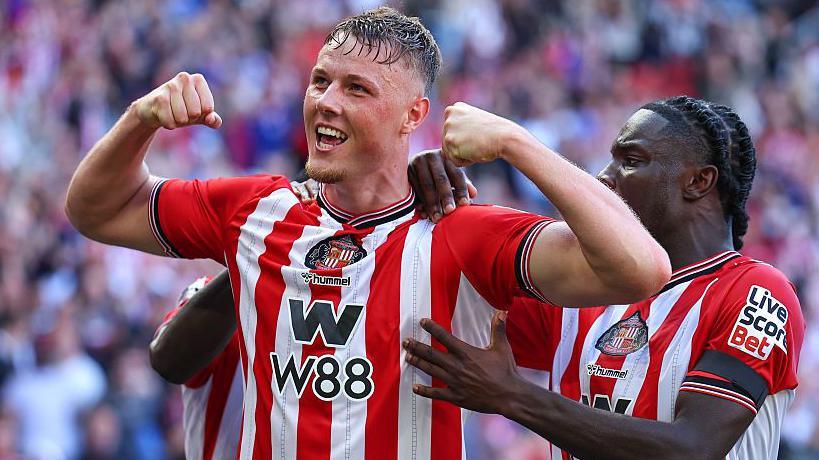Daniel Ballard celebrates