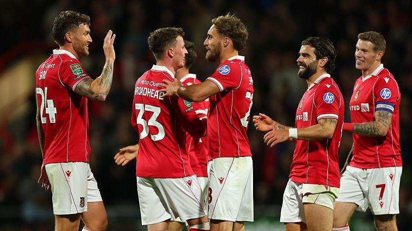 Nathan Broadhead celebrates with Wrexham team-mates 