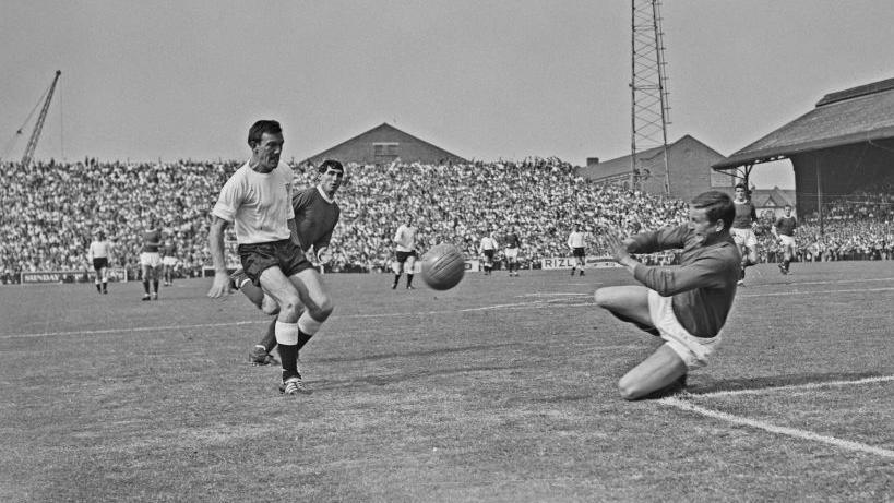 David Gaskell makes a save while playing for Manchester United against Fulham in a Division One match in September 1964