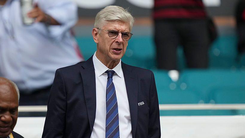 Arsene Wenger wearing a Fifa blazer