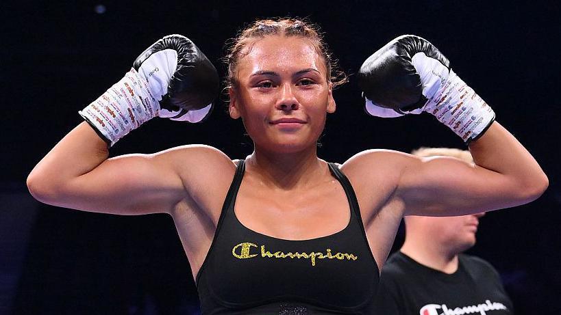 Tiah-Mai Ayton flexing her biceps