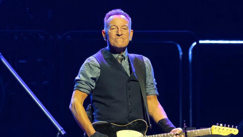 Bruce Springsteen playing guitar