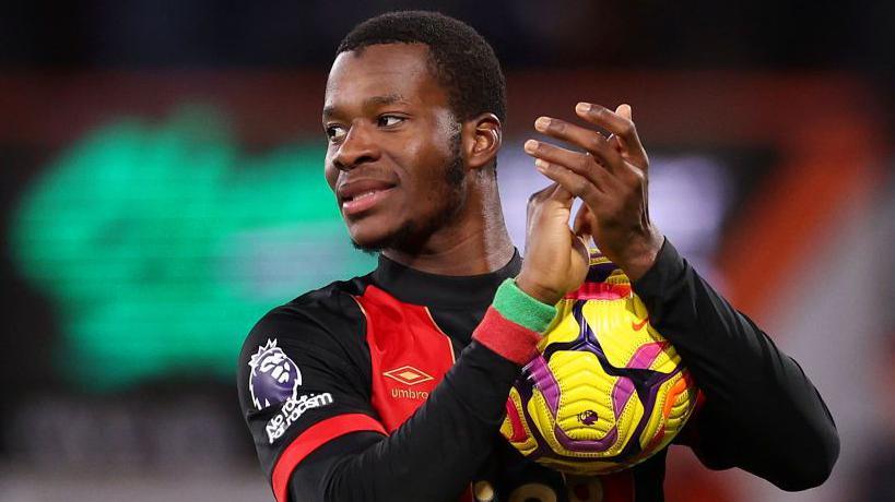 Bournemouth's Dango Ouatarra with the match ball after his hat-trick against Nottingham Forest