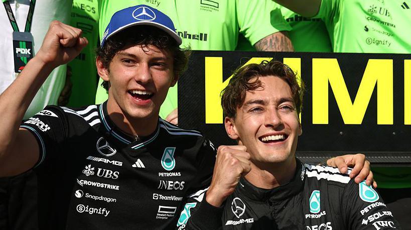 George Russell and Kimi Antonelli celebrating with the Mercedes team after the Canadian Grand Prix