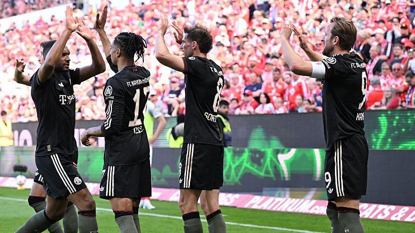 Harry Kane celebrates with Bayern Munich team-mates