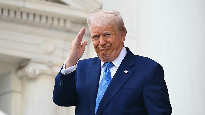 US President Donald Trump arrives to deliver remarks at the National Memorial Day Observance at the Memorial Amphitheatre in Arlington National Cemetery in Arlington, Virginia, on May 26, 2025.