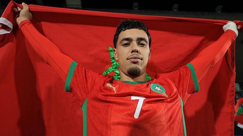 Othmane Maamma with the Morocco flag