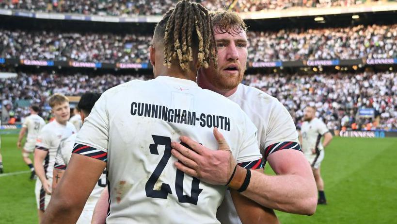 Chandler Cunningham-South and Ollie Chessum hug