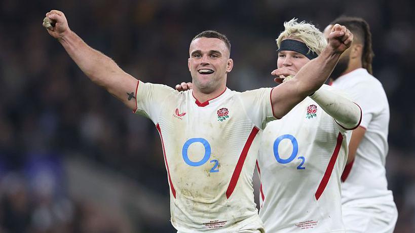 Ben Earl celebrates with arms aloft, with Henry Pollock embracing him and Chandler Cunningham-South visible in the background