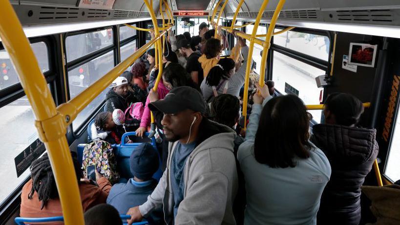 Passengers ride the MBTA #1 bus in Boston