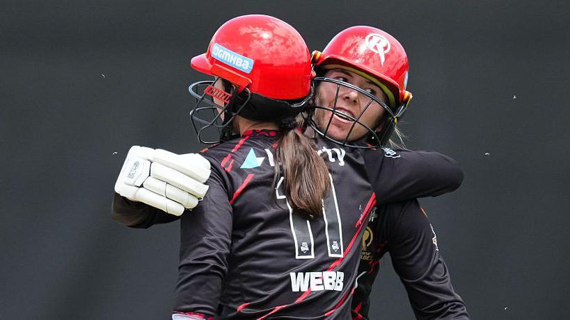 Courtney Webb and Georgia Wareham celebrate Melbourne Renegades' win