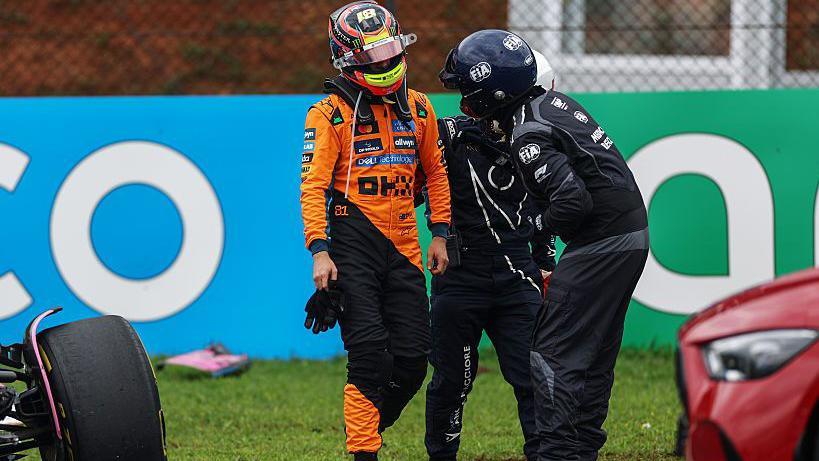 McLaren's Oscar Piastri speaks to a marshal after crashing out of the Sao Paulo Grand Prix sprint race