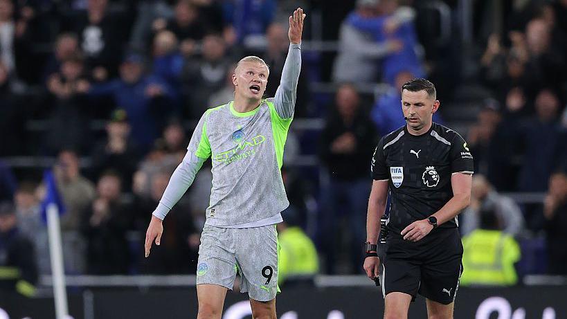 Erling Braut Haaland of Manchester City argues with Referee Michael Oliver
